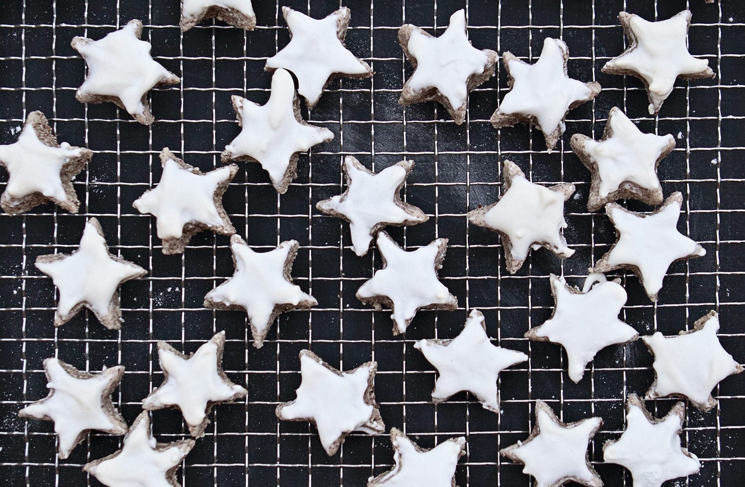 collection of homemade cinnamon star after a german recipe on a cooling tray