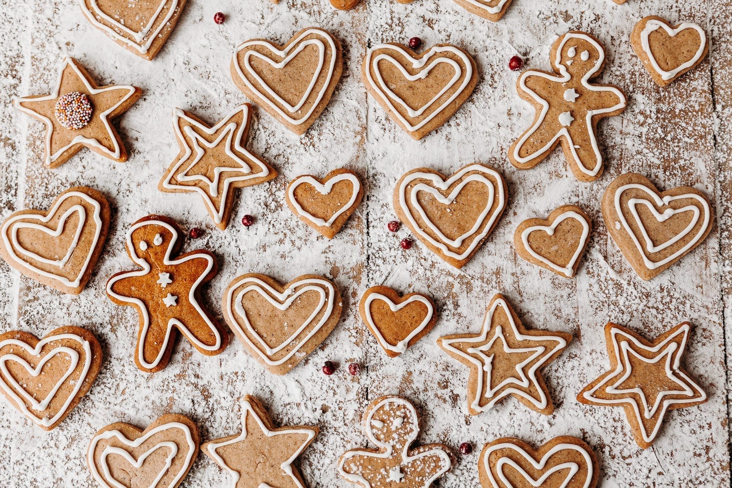 scandinavian homemade gingerbread cookies on a white background, hearts, stars