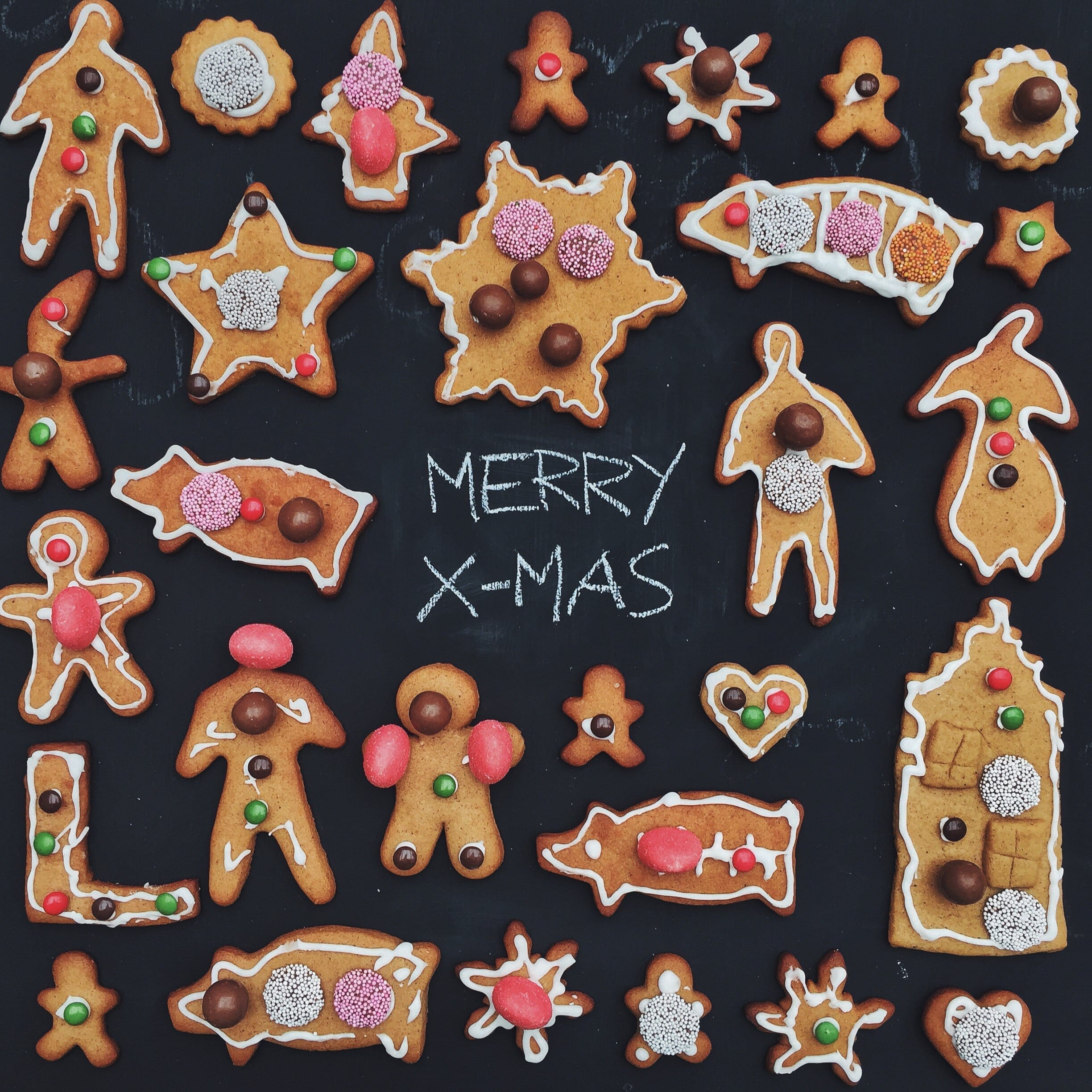 colorful Scandinavian homemade gingerbread cookies on a black background,