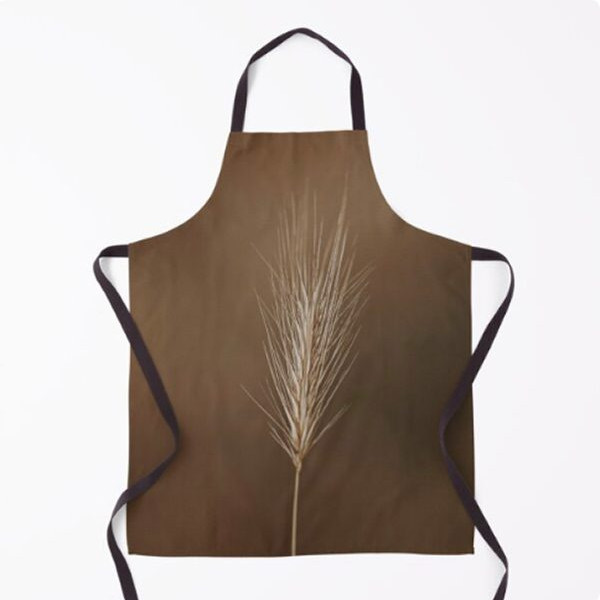 apron with macro shot of grass on brown background